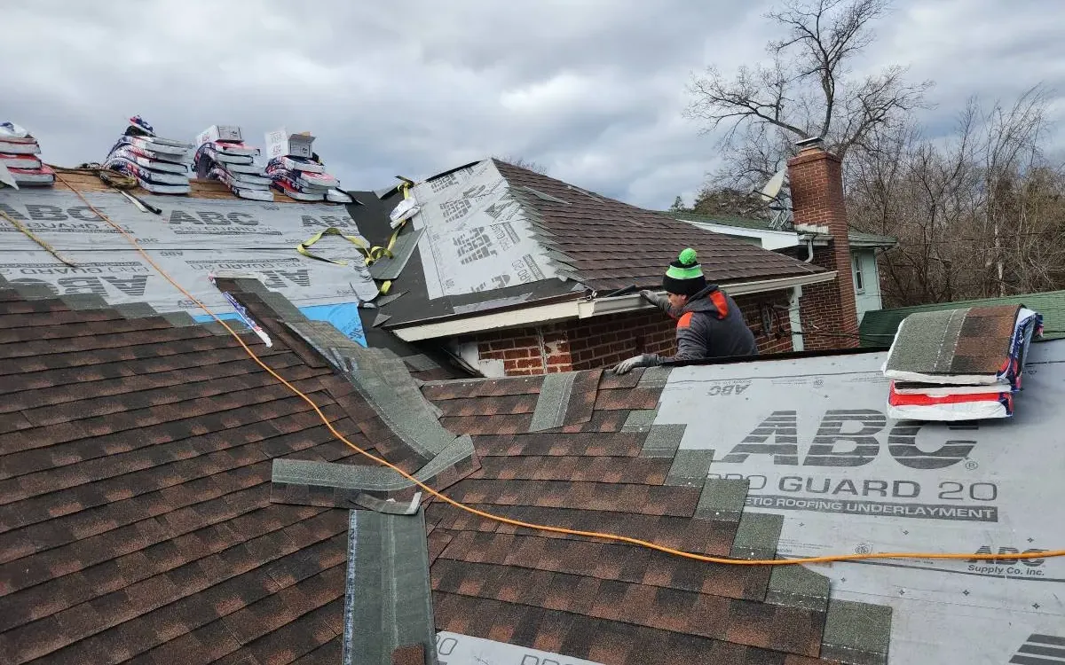 New shingle roof being installed over underlayment